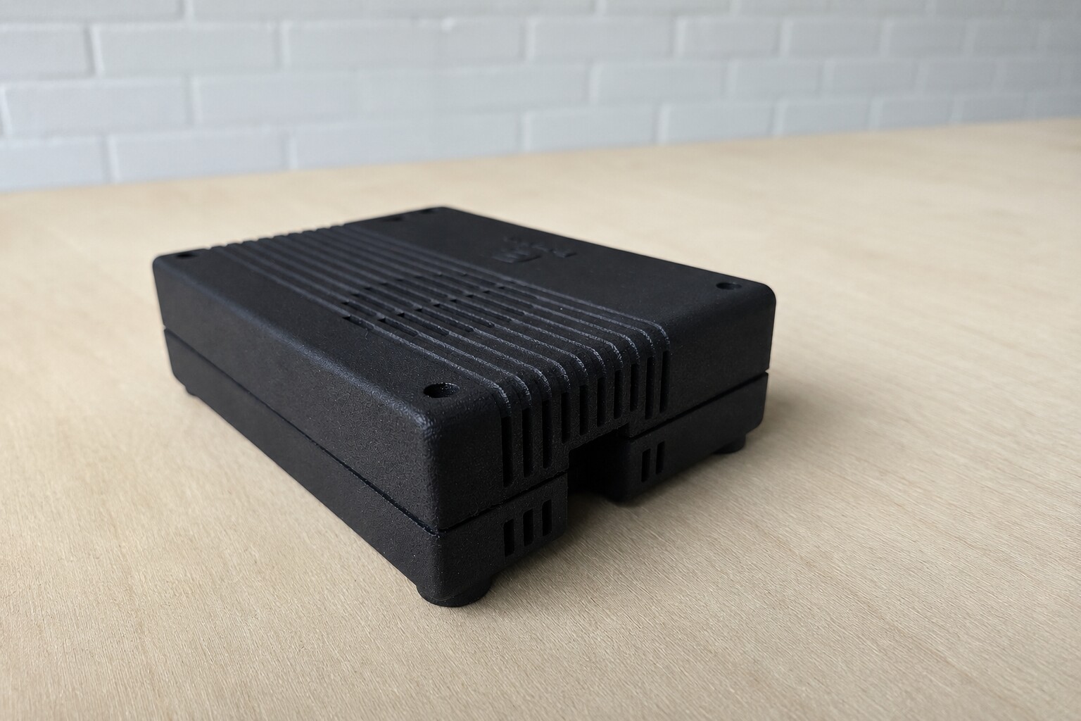 The compact black edge computer Edgentik configures for an initial camera deployment